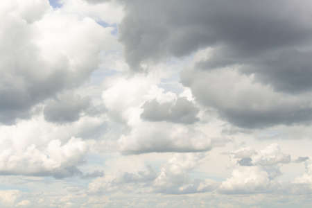 White cumulus clouds in blue sky at daytime. Natural background photo textureの写真素材