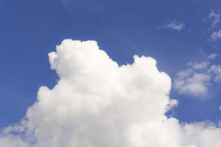 White cumulus clouds in blue sky at daytime. Natural background photo textureの写真素材