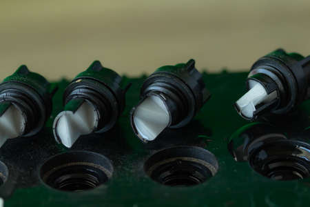 The battery cover is open on top on glay colour background,の写真素材