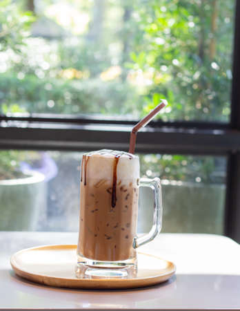 Ice coffee a late art in the glass on the table background,の写真素材
