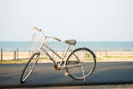 Gray Vintage bicycle parked near the sea