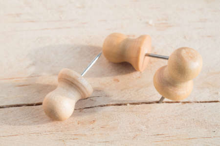 Pin nail on wooden board の写真素材