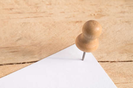 Pin nail on wooden board の写真素材