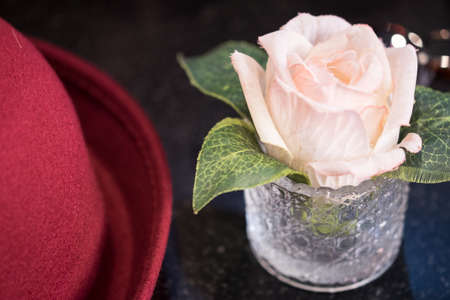 Pink Artificial Rose in Glass place on black marble table topの写真素材