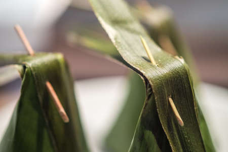 Kanom Sai Sai (Steamed Flour with Coconut Filling wrapped in banana leaf) Thai Traditional Dessert