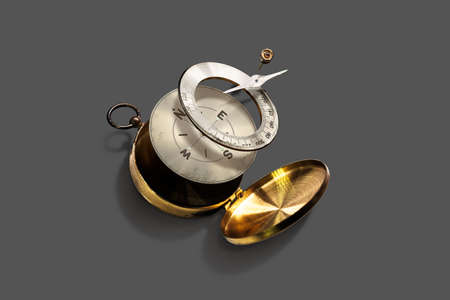Disintegrate Brass Compass placed on gray background for easy  isolate