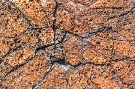 The background stone is brown in the cracksの写真素材