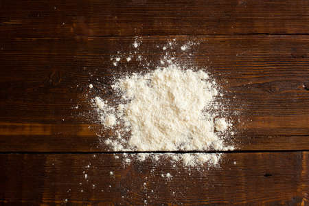 Wheat flour for preparing bakery products on the wooden tableの写真素材
