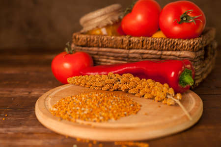 Grains, chili and tomatos are on the tableの写真素材