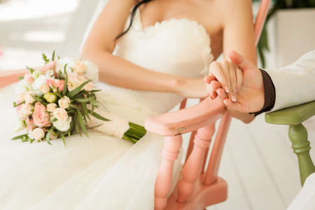 Beauty bride in wedding dress in romantic cute interiorの写真素材