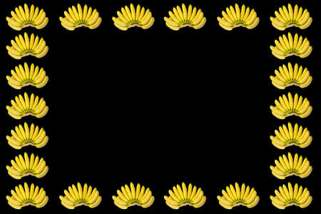 Bright Fresh Yellow Bananas Brunches Pattern Frame Isolated on Black Backgroundの写真素材
