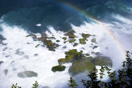 Rainbow over the waterfallの写真素材