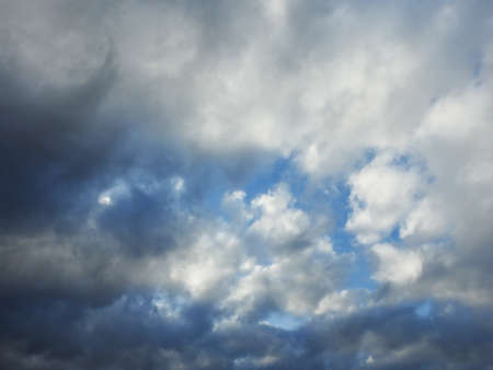 Storm gray cloud and blue skyの写真素材