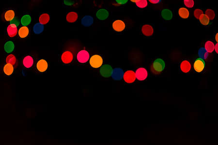 Colorful christmas light bokeh for backgroundの写真素材