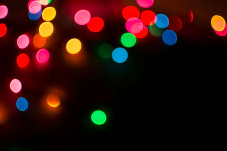 Colorful christmas light bokeh for backgroundの写真素材