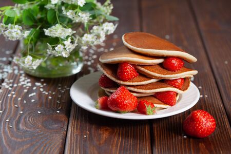 Delicious, only baked pancakes with strawberriesの写真素材