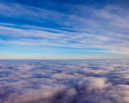 Superb heavenly clouds blue sky image. View from aircraft airplane