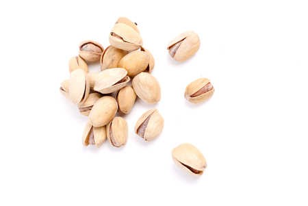 Solted pistachio nut at white isolated backgroundの写真素材