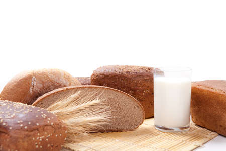 Fresh brown bread with a glass of milk