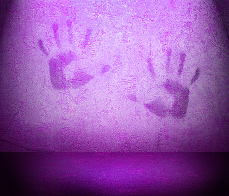 abstract  textured background with print of human palmsの写真素材