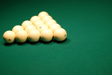 picture of green billiard table with white balls