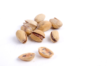 Solted pistachio nut at white isolated backgroundの写真素材