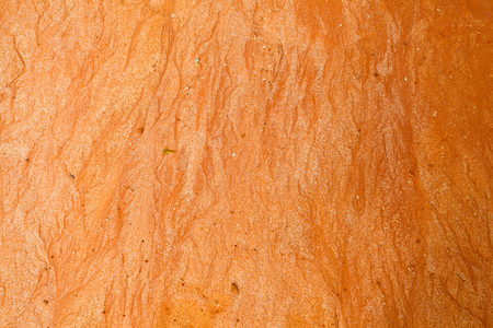 Texture of red wet sand with different wavesの写真素材