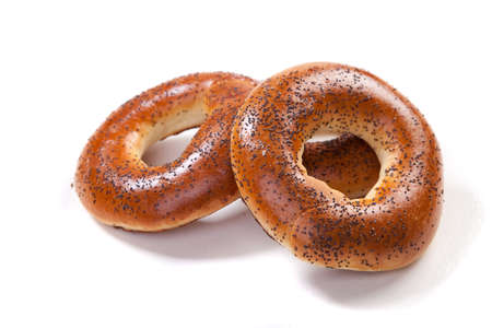 Fresh wheat ring bagel with poppyseed. Isolated Macroの写真素材