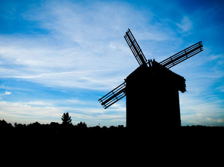 windmill on the field and blue cloudy skyの写真素材