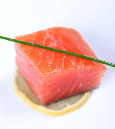 Raw fresh red salmon at white plate