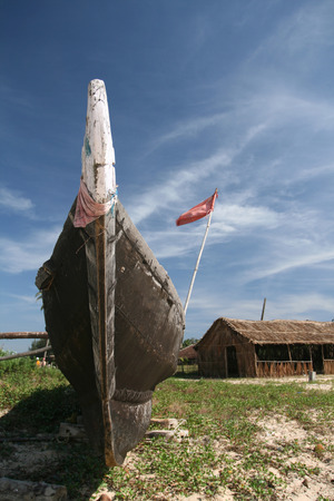 black fishing boat standing on the beachの写真素材