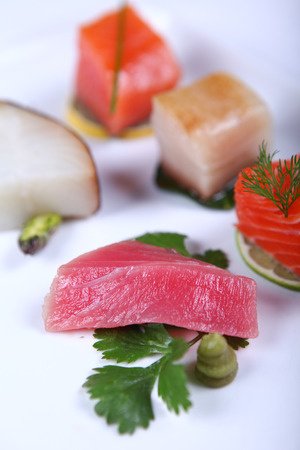 Fresh sashimi decorated with greens and lime. Close-upの写真素材