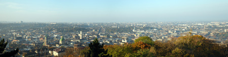 autumnal panorama of a city with lush vegetationの写真素材