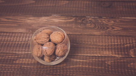 A lot of nuts are  on a dish at the tableの写真素材