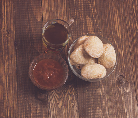 Tea, buns and jam are on the tableの写真素材