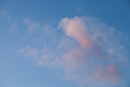 Beautiful light-blue sky with white fluffy clouds