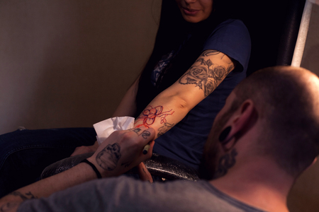 Tattoo artist is preparing the area that will be tattooedの写真素材
