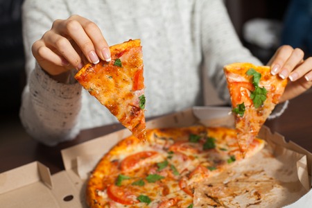 Delicious pizza  sliced on piecesの写真素材