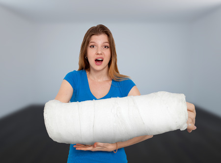 Woman With Huge Broken Hand In Bandageの写真素材