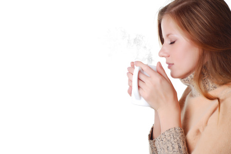 Beautiful woman in sweater with cup of coffee