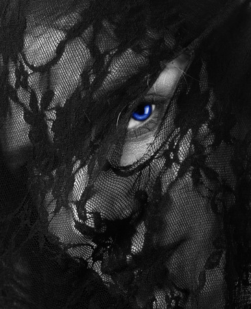 woman face in a mask of black lace の写真素材