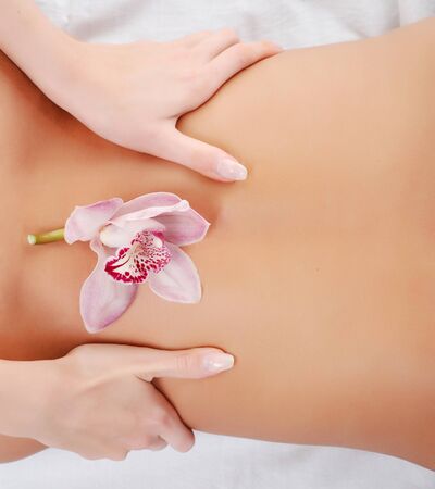 Beautiful young woman take enjoyment in massageの写真素材