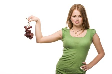 young beautiful woman with bunch of grapes