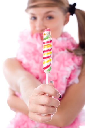 young woman in pink jabot with colored lollipopの写真素材