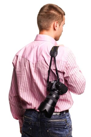 Young handsome man in pink shirt with cameraの写真素材