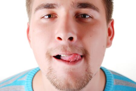 portrait of a young funny man with tongue