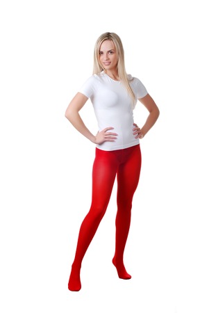 beautiful woman in red tights at white backgroundの写真素材