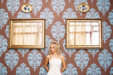 Beauty young blonde bride in amazing wedding dressの写真素材