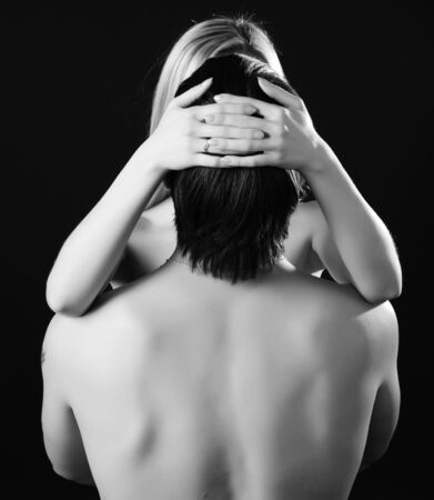 young loving couple isolated at black backgroundの写真素材