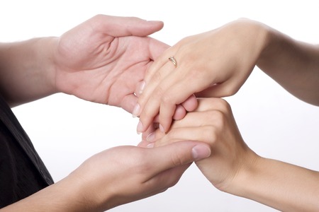 hands of young loving couple isolated at white background